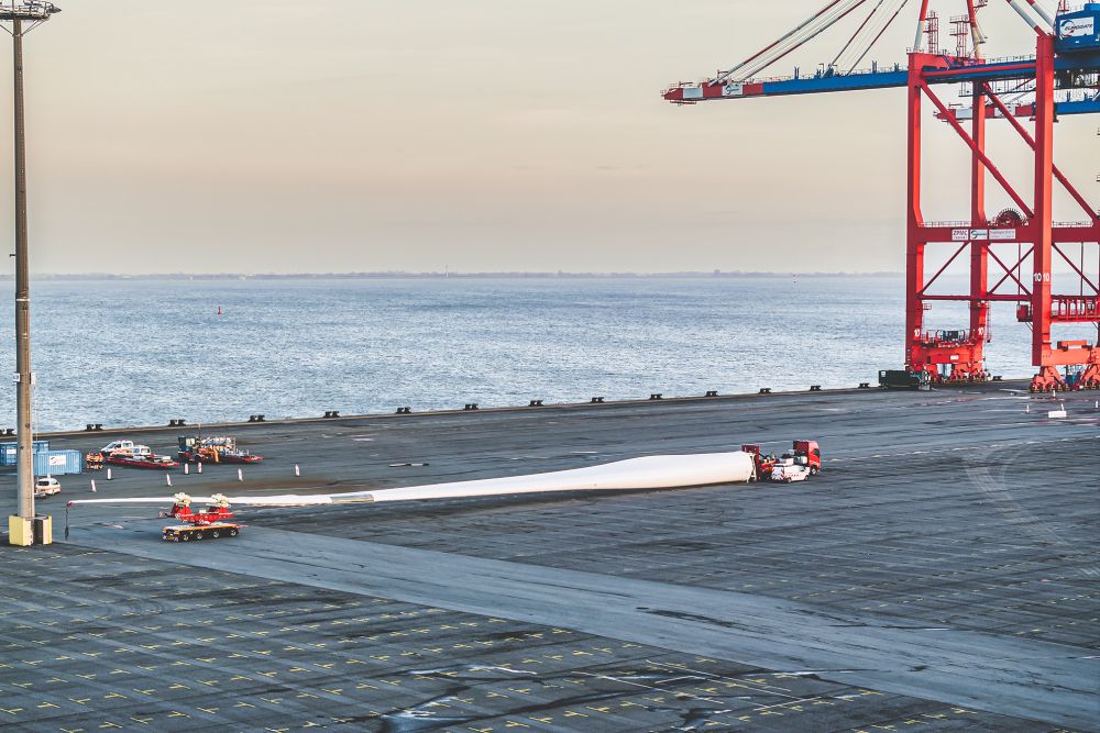 DOLL heavy transport vehicle for wind turbines at the harbor at sunset